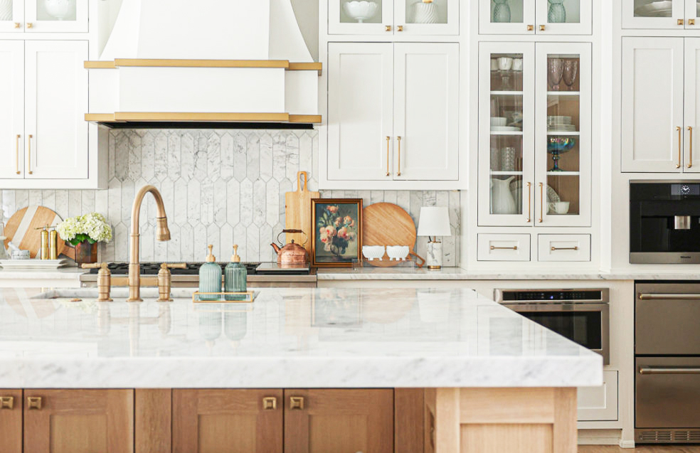 A stunning luxury kitchen remodel in Sacramento, featuring elegant marble countertops and custom cabinetry, completed by Sacramento Plumbing Pro.