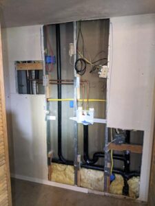 Sacramento utility room undergoing a plumbing overhaul, equipped with state-of-the-art piping.
