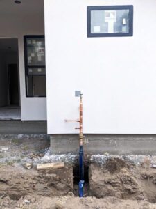 New main water valve installation on Sacramento property, showcasing precise and secure plumbing work.