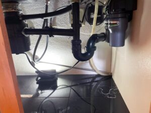 Expert plumbing upgrade under a Sacramento kitchen sink featuring high-quality pipe installations.